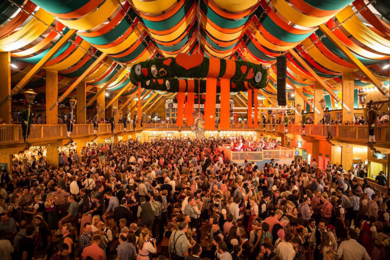 oktoberfest beer tent green yellow red celling decorationwith crowded peape