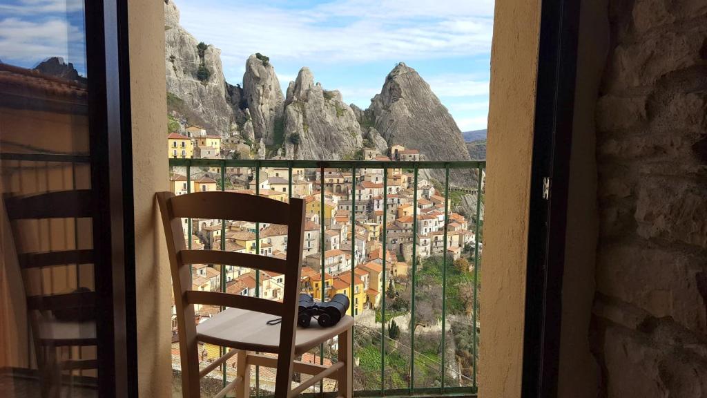 Densly crowded houses under the Dolomites rock view from window of Casa delle Stelle hotel