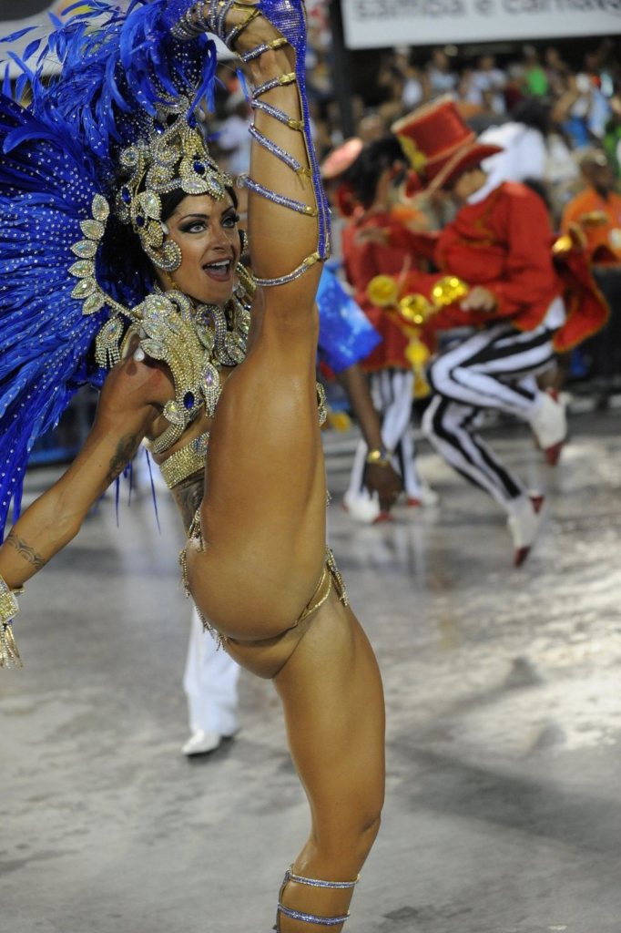 a brazialian girl showing one leg up  of her head one leg down in underwear,carnival costume