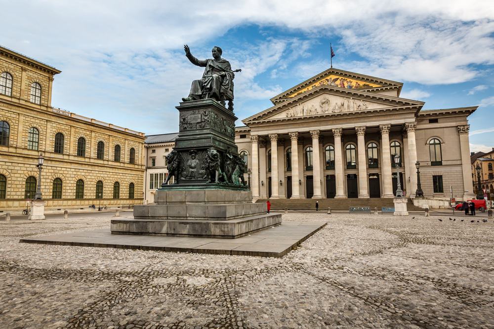 Munich Theatre its 8 column and the residenz royal palace with a king staue in center