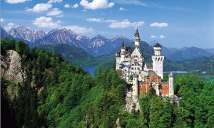 perfect 3 days in munich: The majestic neuschwanstein castle tours in center of green hilly landsscape and the sea at the back book Where to visit in 2 days in germany