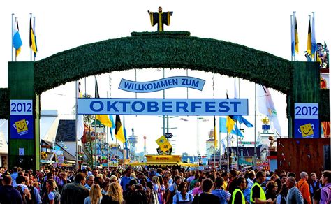Munich day tours: green arched Welcome to Oktoberfest gate to the Theresiewise