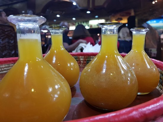Addis Ababa in 5 Hours - 5 .glasses-flasks filled with yellow mead-honey wine
